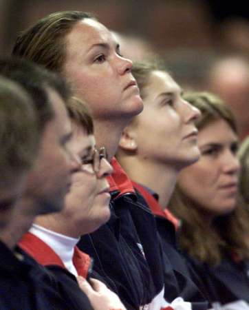 Fed Cup 2000: Members of the United States Federation Cup team stand at attention during the national anthem before their semi-final match against Belgium November 22, 2000 at the Mandalay Bay Events Center in Las Vegas. From left are captain Billie Jean King, Lindsay Davenport, Monica Seles and Jennifer Capriati.