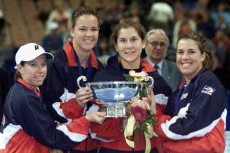 Fed Cup 2000: The United States Fed Cup team members pose with the 2000 Fed Cup November 25, 2000 at the Mandalay Bay Event Center in Las Vegas. From left are: Lisa Raymond, Lindsay Davenport, Monica Seles and Jennifer Capriati. The United States swept Spain in the finals 5-0 for their second consecutive cup. REUTERS/Thierry Roge .